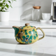 KUTANI WARE JAPNESE TEAPOT (YOSHIDAYA STYLE)CAMELLIA AND BIRD DESIGN (WITH NETTING)